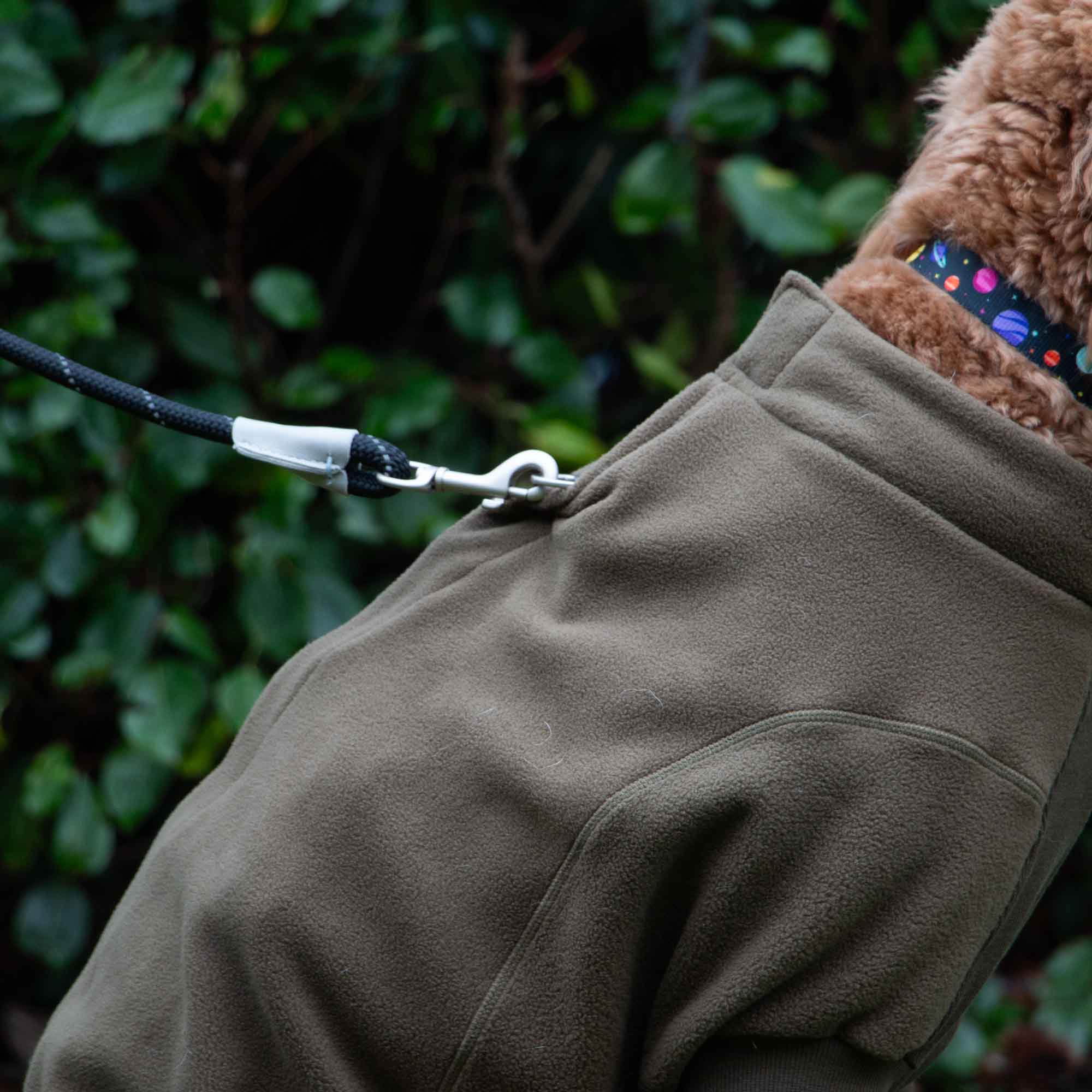 Close-up of the khaki fleece at the neck with a lead clipped to the collar