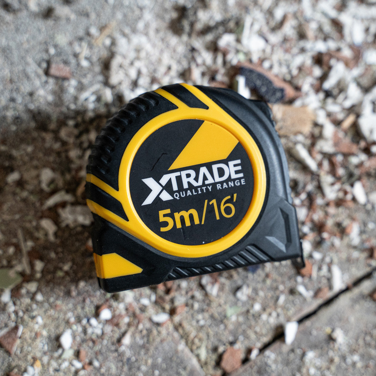 XTrade 5m / 16ft tape measure on a building site floor